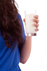 Image showing beautiful smiling woman is drinking milk