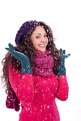 Image showing beautiful smiling brunette woman in snow in winter 