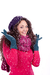 Image showing beautiful smiling brunette woman in snow in winter 