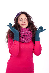 Image showing beautiful smiling brunette woman in snow in winter 