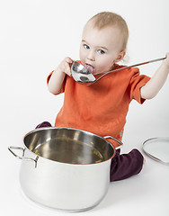 Image showing baby with big cooking pot