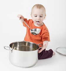 Image showing baby with big cooking pot