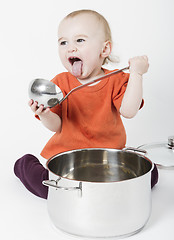 Image showing baby with big cooking pot