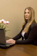 Image showing pretty woman at desk
