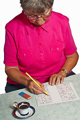 Image showing pensioner with sudoku