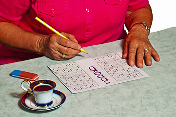 Image showing pensioner with sudoku