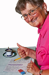Image showing pensioner with sudoku