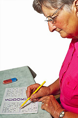 Image showing pensioner with sudoku