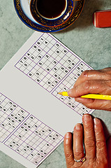 Image showing pensioner with sudoku