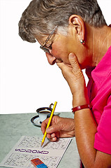 Image showing pensioner with sudoku