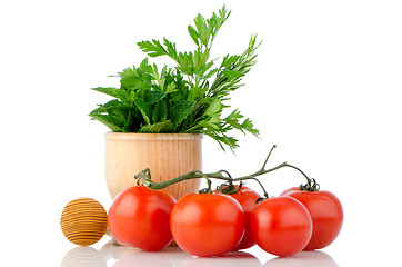 Image showing Tomatoes and green herb leafs 