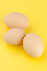 Image showing Three brown eggs