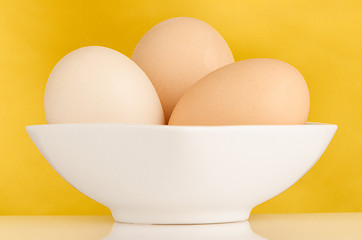 Image showing Three eggs in the bowl 