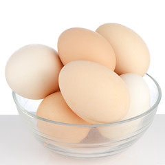 Image showing Brown eggs in transparent bowl