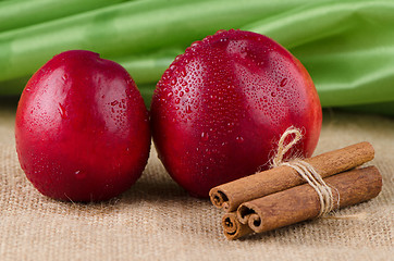 Image showing Peaches  and cinnamon sticks