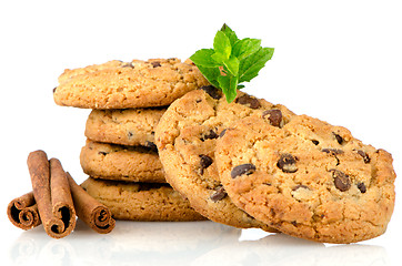 Image showing Tasty oat biscuits with cinnamon sticks