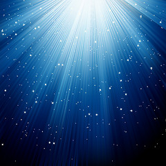 Image showing Snowflakes and stars descending blue light. EPS 8