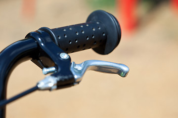 Image showing handle of a bike with the brake lever