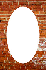 Image showing Red brick wall and white oval in center 