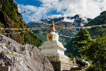 Image showing Buddhism: stupe or chorten with prayer flags in Himalayas