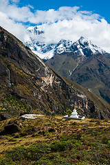 Image showing Buddhist stupe or chorten and summits in Himalayas