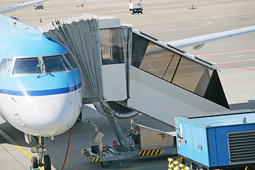 Image showing Airplane at an airport with passenger gangway 