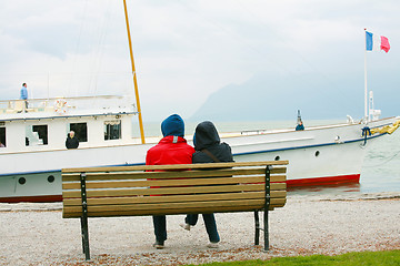 Image showing Couple watching boat on the winter