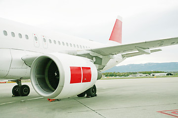 Image showing engine of passenger airplane waiting in airport 