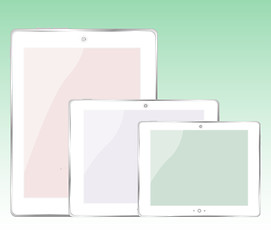 Image showing tablet pc set on green background