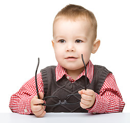 Image showing Portrait of a cute little boy wearing glasses