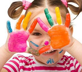 Image showing Portrait of a cute girl with painted hands