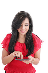 Image showing Young smiling business woman with tablet computer. Isolated on w