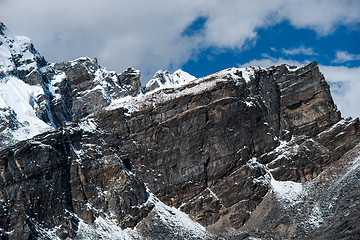 Image showing From the top of Gokyo Ri: rocks and snowed cliffs view