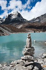 Image showing Harmony: Stone stack and Sacred Lake near Gokyo