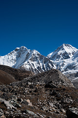 Image showing Snowbound mountain peaks and blue sky in Himalayas