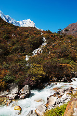 Image showing Landscape in Himalayas: snowed peaks and stream