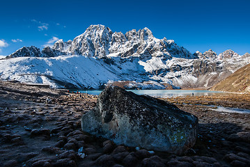 Image showing Sacred Gokyo Lake near village and mountain peaks in Himalayas