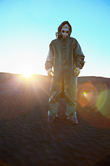 Image showing Man in protective suit and rays of sun