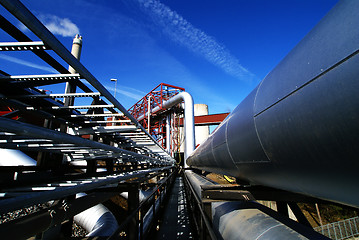 Image showing different size and shaped pipes and valves at a power plant