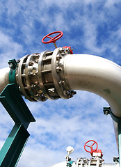 Image showing industrial pipelines and valve with a natural blue background