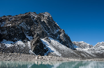 Image showing Mountain and Sacred Lake near Gokyo in Himalayas