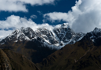 Image showing Snowbound mountain peaks and clouds in Himalayas