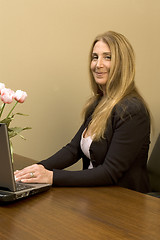 Image showing pretty woman at desk