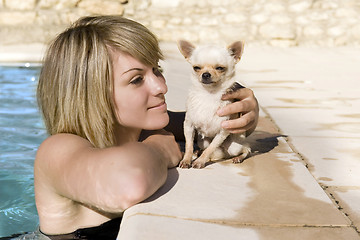 Image showing chihuahua and girl in the swimming pool