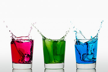 Image showing Red Green Blue splashing ice cubes