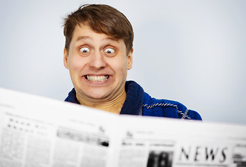 Image showing Man shocked by news from the newspaper