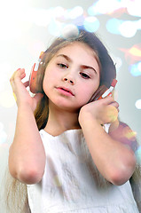 Image showing child with headphones listebing to music