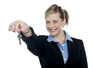 Image showing Happy aged woman holding keys