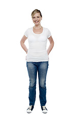 Image showing Casual trendy female with hands in jeans pocket