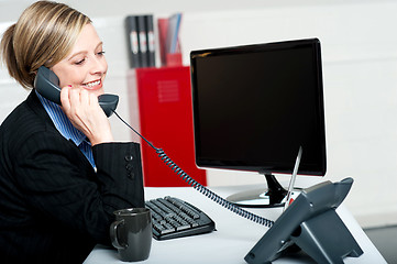 Image showing Female secretary answering bosses call